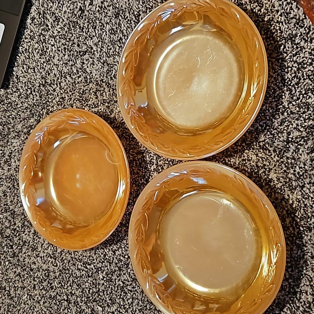 Set of 3 peach iridescent bowls fire king laurel pattern.